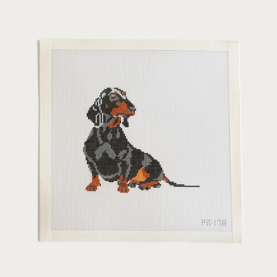 Needlepoint canvas featuring a dachshund design, hand-painted on 18 mesh, approx. 5" x 5".