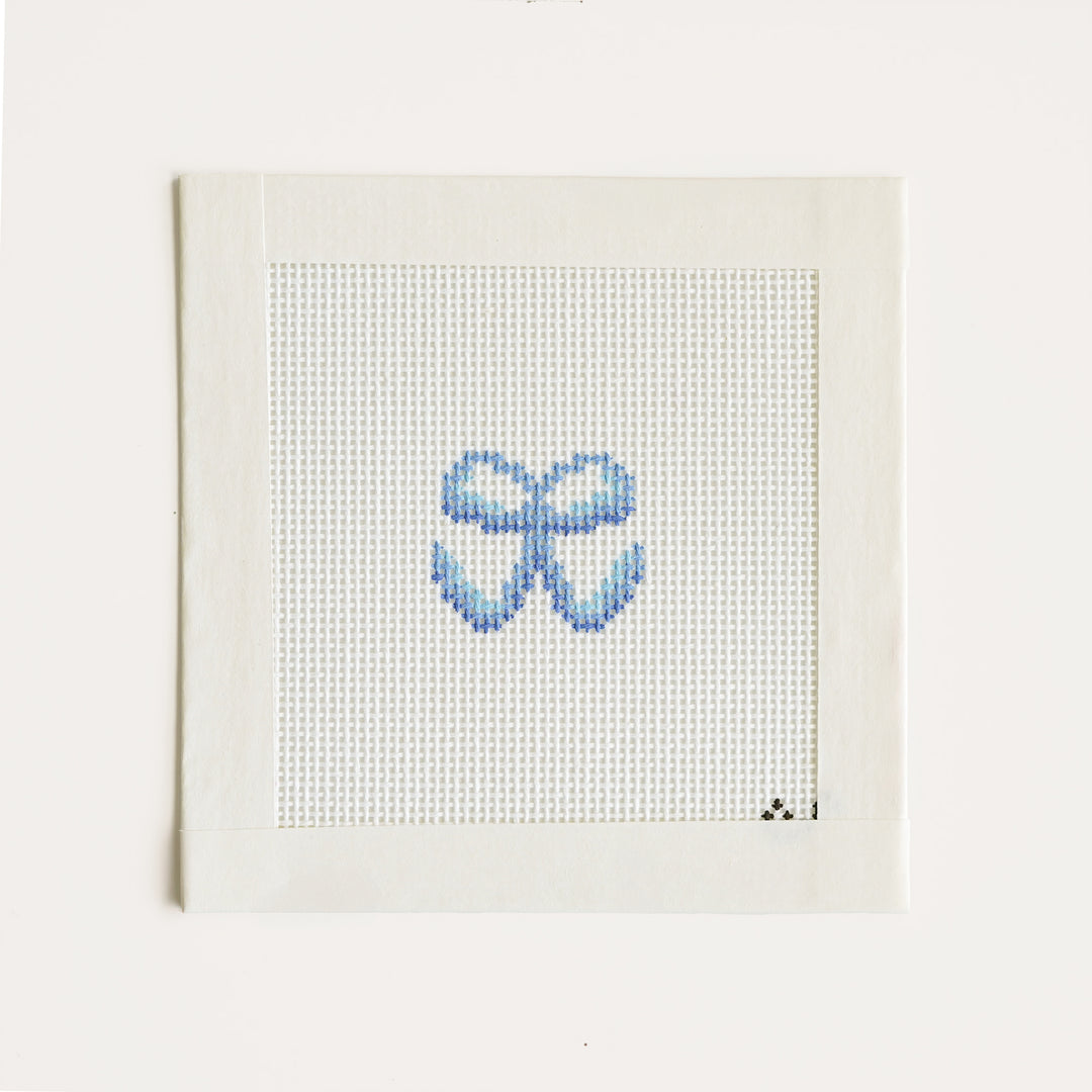 Mini blue bow needlepoint canvas hand-painted on 18 mesh, approximately 1.5 by 1.5 inches