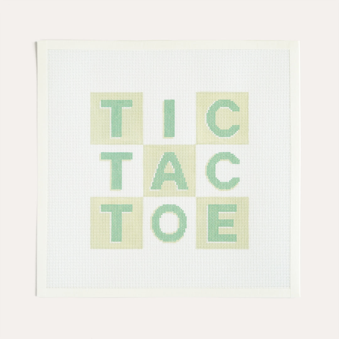 Green Tic-Tac-Toe needlepoint canvas by The Needlepoint Vault on 13 mesh, finished as game board pillow or framed