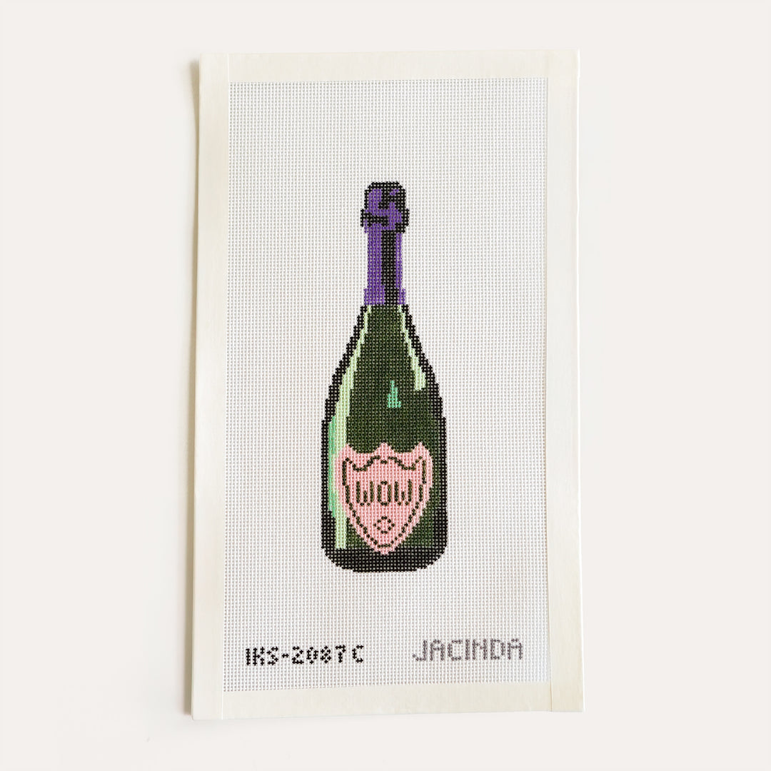 Hand-painted Wow champagne bottle needlepoint ornament on 18 mesh canvas by Jacinda Boneau