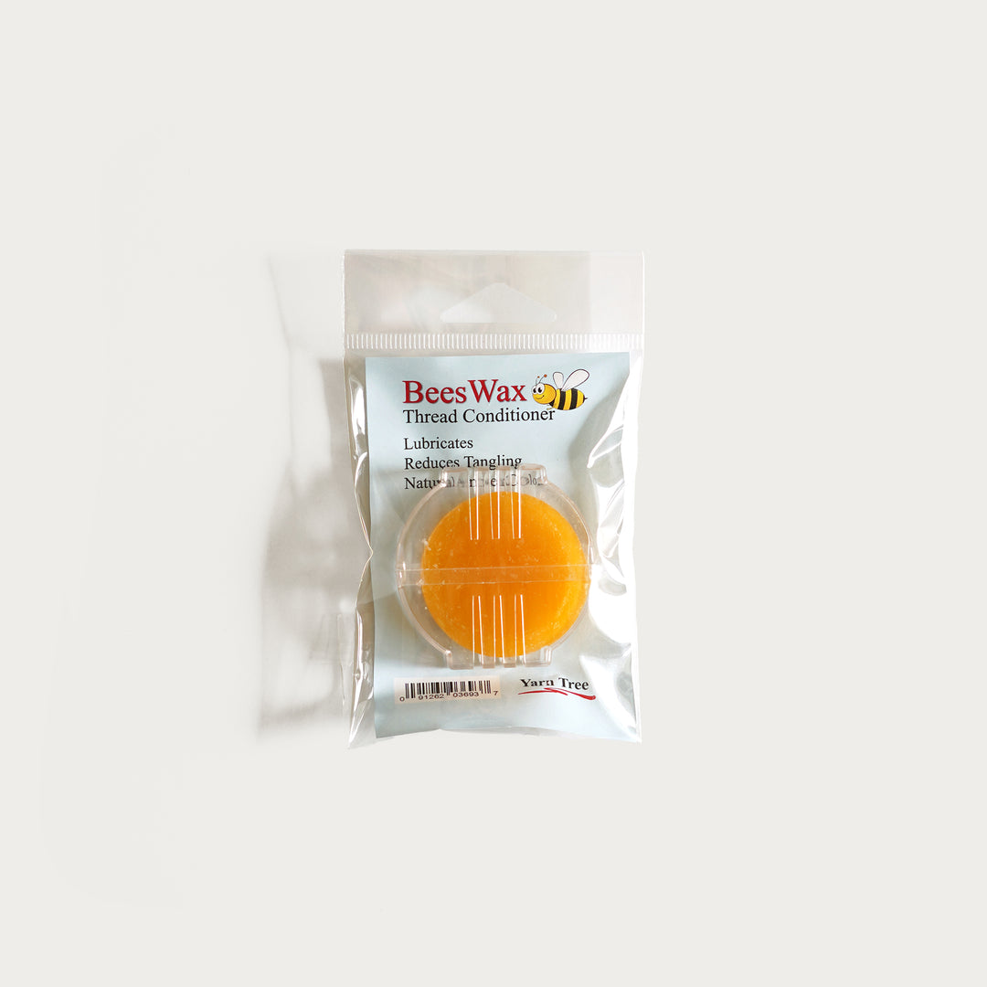 Amber Yellow Beeswax thread conditioner for needlepoint, reduces tangling and fraying for smooth stitching.