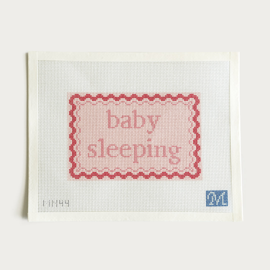 Hand-painted Baby Sleeping needlepoint canvas in pink, 10.5" x 5.8" on 13 mesh. A charming nursery or baby room décor piece.