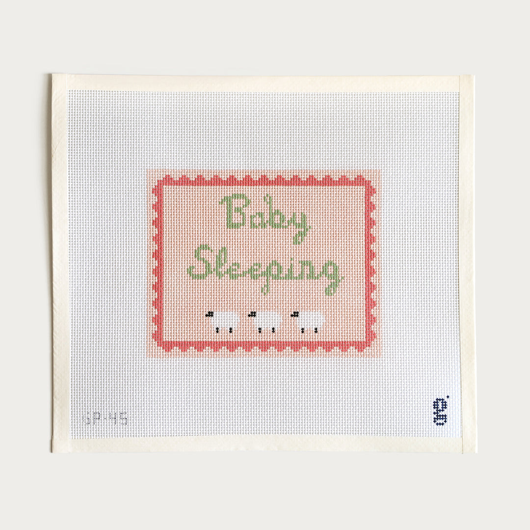  Baby Sleeping needlepoint canvas in pink, 6.6” x 5.3” on 13 mesh, perfect for a nursery.