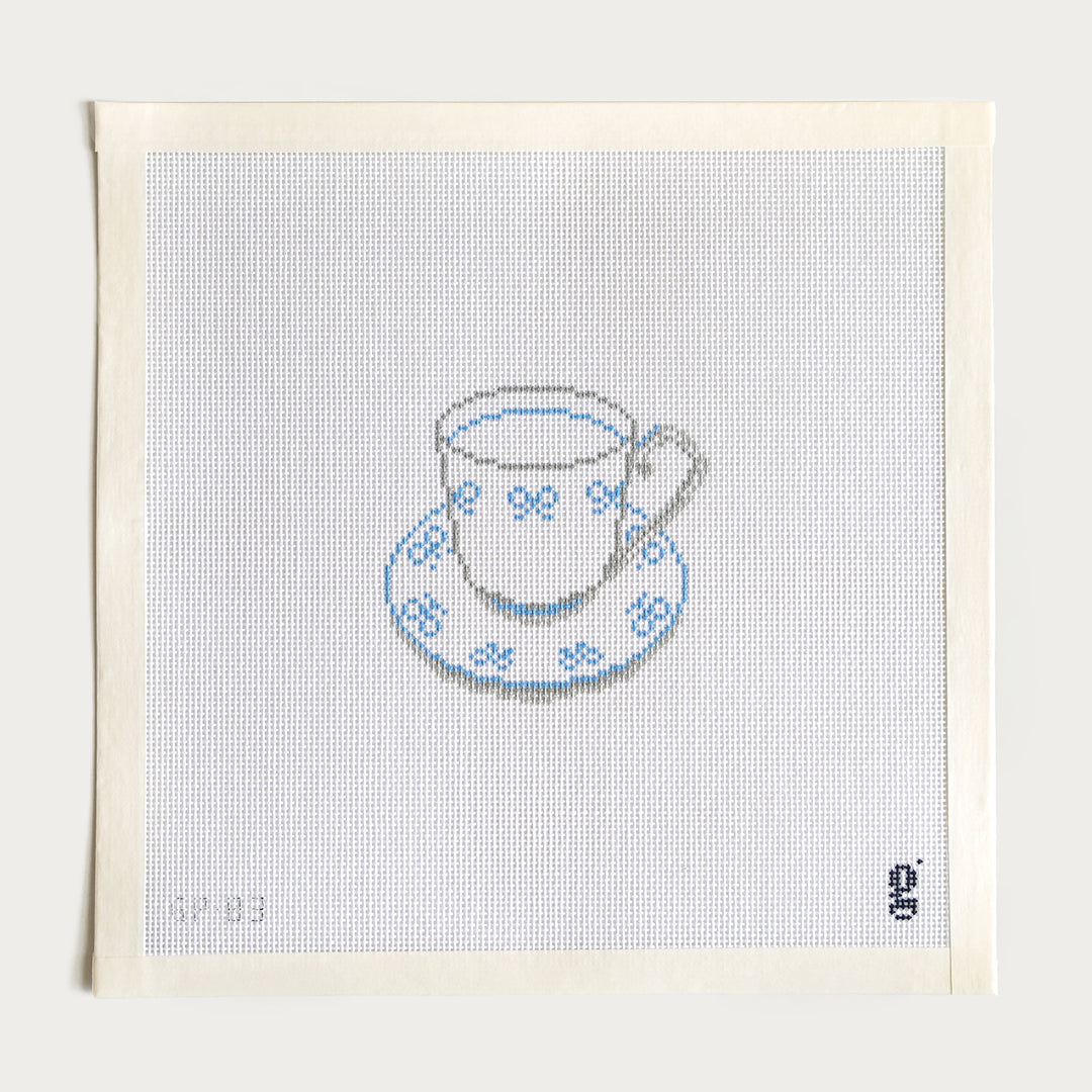 Hand-painted Blue Bow Teacup needlepoint canvas, 2.8" x 4.1" on 18 mesh, with a teacup and blue bows.