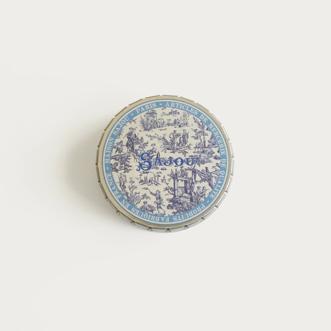 Round tin with blue Toile de Jouy print, ideal for storing needlepoint tools, needles, and small accessories.