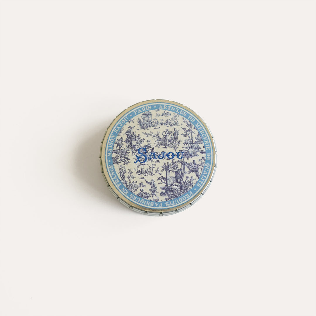 Round tin with blue Toile de Jouy print, ideal for storing needlepoint tools, needles, and small accessories.