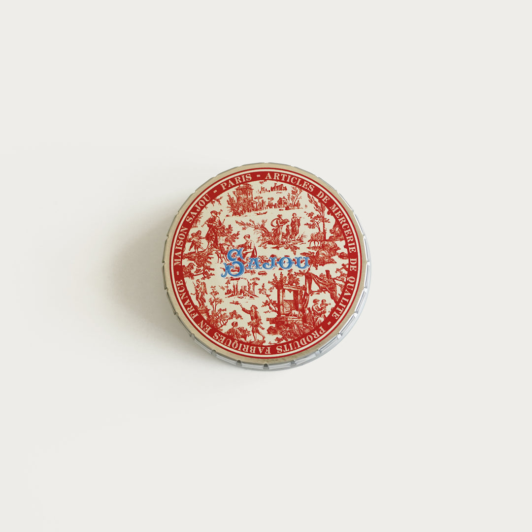 Round tin with red Toile de Jouy print, ideal for storing needlepoint tools, needles, and small accessories.