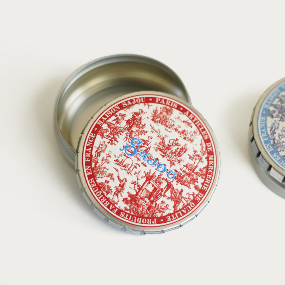Round tin with red Toile de Jouy print, ideal for storing needlepoint tools, needles, and small accessories.