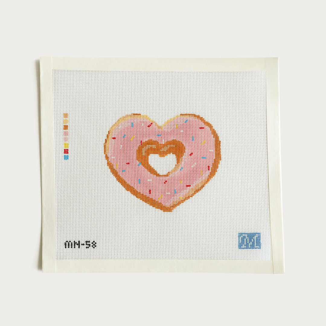 Hand-painted heart-shaped donut needlepoint canvas on 18 mesh, measuring 4.4” x 3.7”.