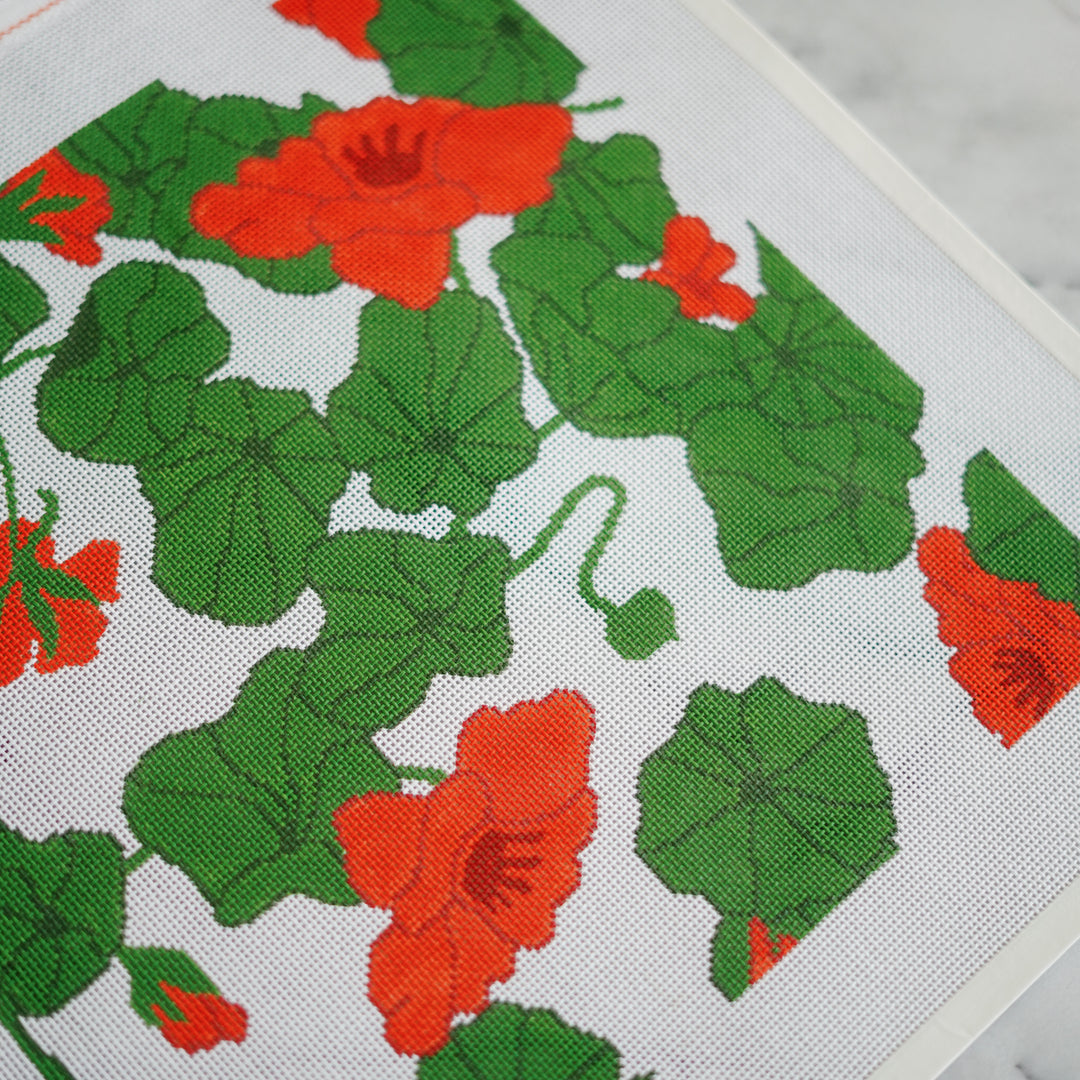Hand-painted Nasturtiums needlepoint canvas on 13 mesh, 14” x 14” design, featuring bold, trailing flowers in a botanical-inspired composition.