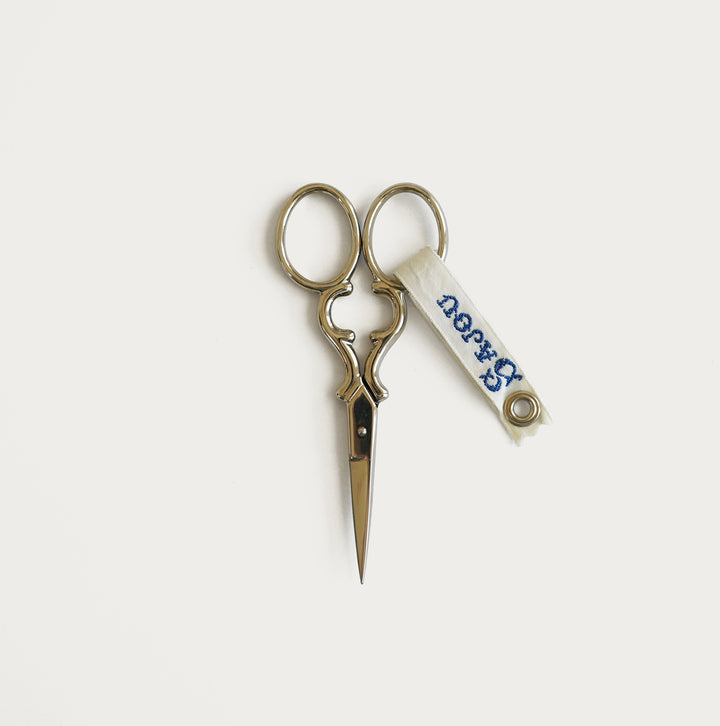 Sajou Nogent embroidery scissors, nickel-plated, 8.9cm with curved handles, presented in a reusable fabric-inspired case.
