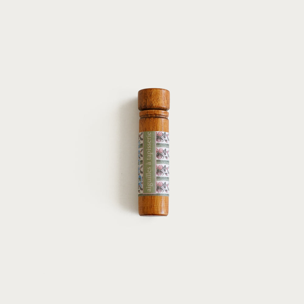 Sajou wooden needle case with floral label, includes six No. 26 tapestry needles, ideal for needlepoint and embroidery.