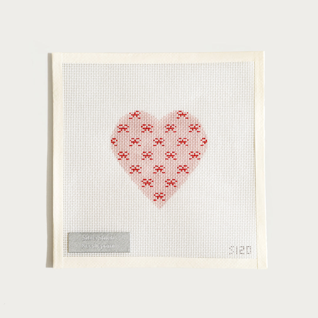 Hand-painted Valentine Mini Bows needlepoint canvas (13 mesh), featuring a heart filled with pink bows.