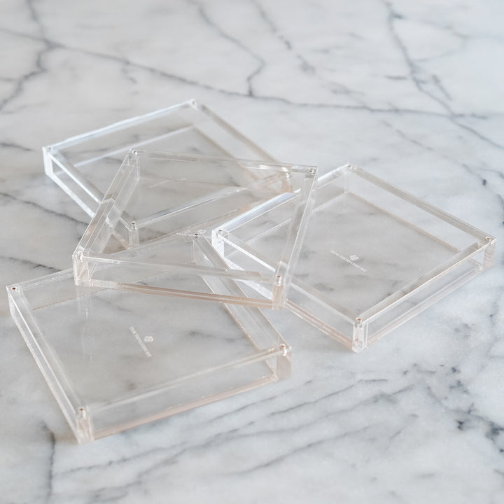 set of four clear acrylic magnetic coasters for displaying 4x4 needlepoint in a modern minimal style