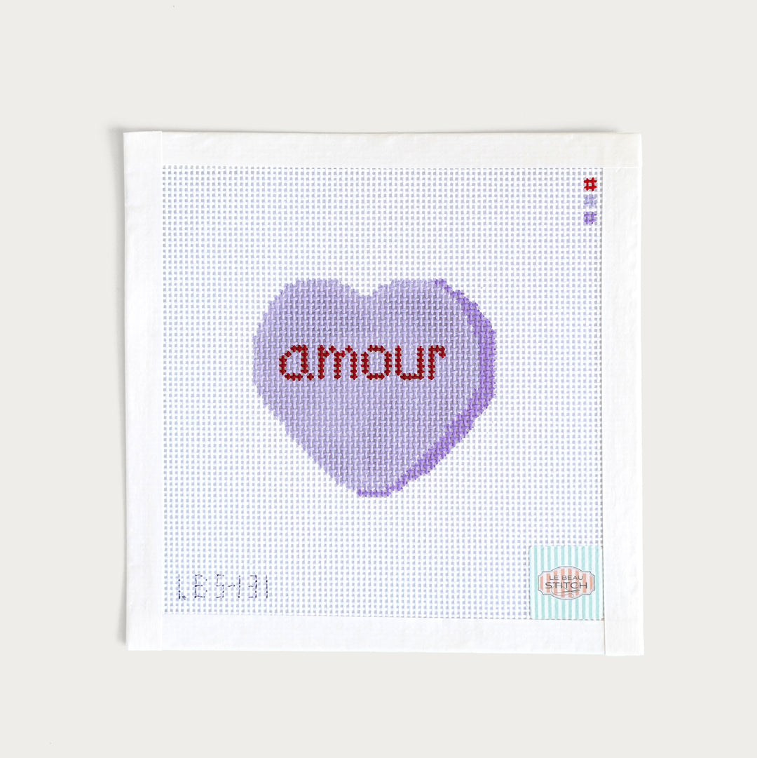 Hand-painted ‘Amour’ Candy Conversation Heart needlepoint canvas on 13 mesh, featuring a romantic French-inspired design.