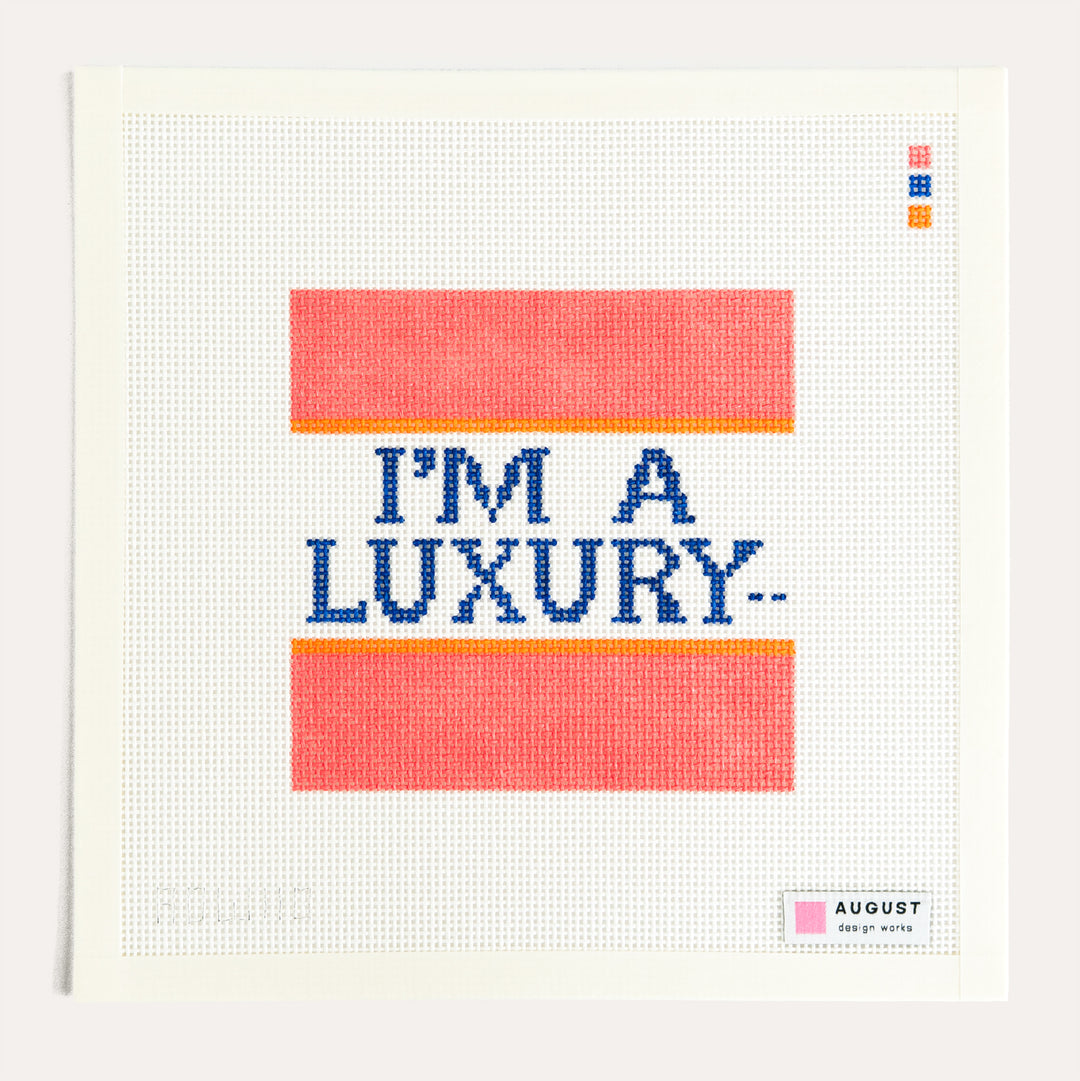Diana "I'm a Luxury" needlepoint canvas by August Design Works inspired by Princess Diana's iconic sweater on 13 mesh canvas.