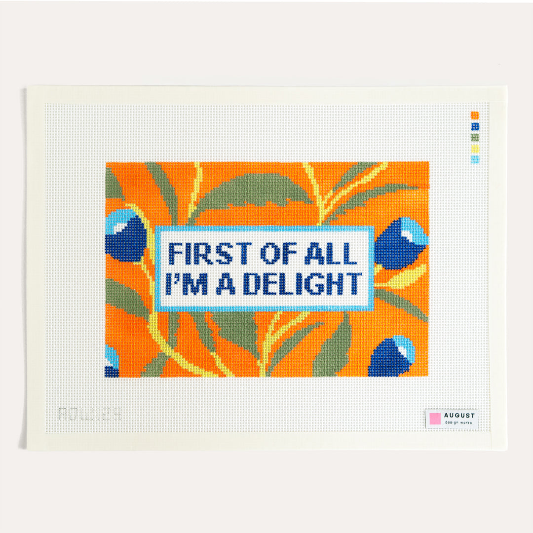 First of All I'm a Delight needlepoint canvas by August Design Works with an orange and blue floral frame on 13 mesh canvas.