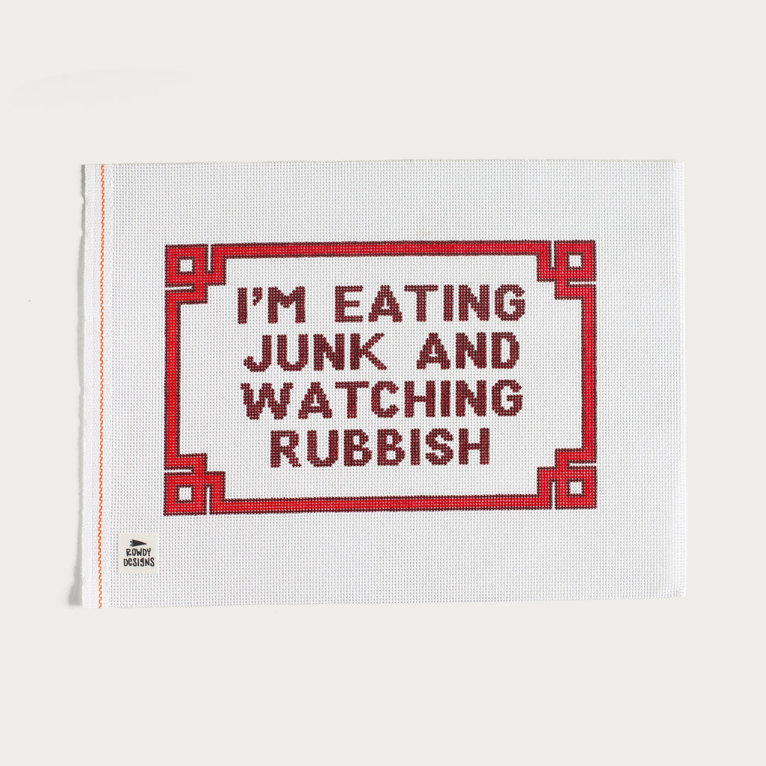 Hand-painted I’m Eating Junk and Watching Rubbish needlepoint canvas with a nostalgic pop culture design.