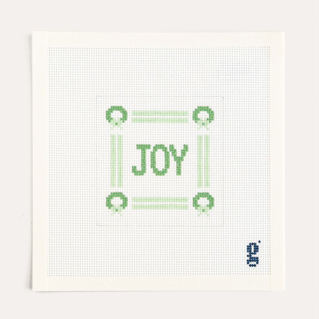 Joy Square Mini Sign needlepoint canvas by Goodpoint featuring a holiday Joy sign design on 13 mesh canvas.