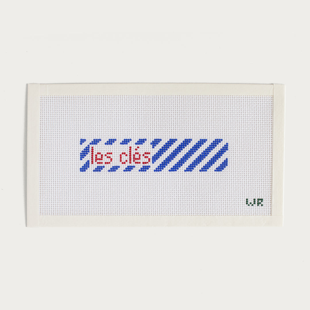 Hand-painted Les Clés key fob needlepoint canvas with a stylish French-inspired design.