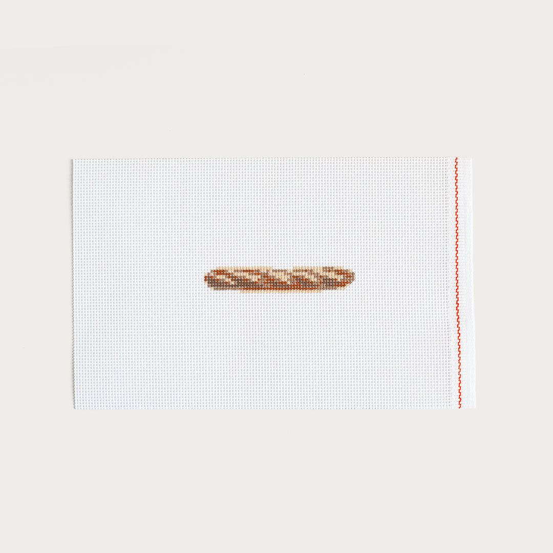 Hand-painted Mini Baguette needlepoint canvas with a French-inspired design.