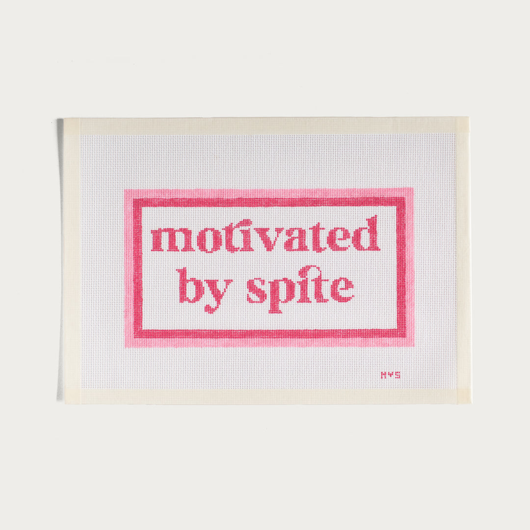 Hand-painted Motivated By Spite needlepoint canvas in pink with a bold statement design.