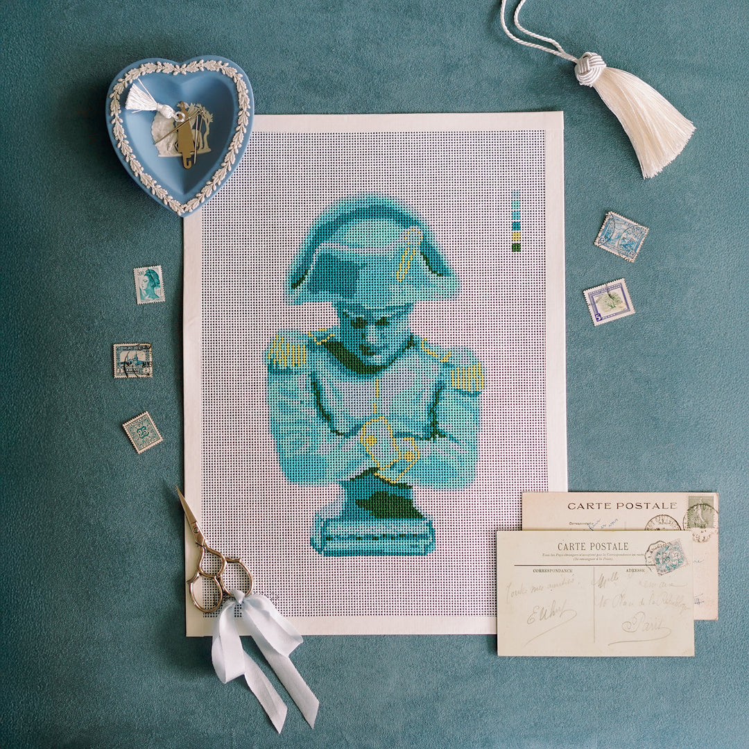 Hand-painted needlepoint canvas of Napoleon bust in blue, aqua, and chartreuse on 13 mesh