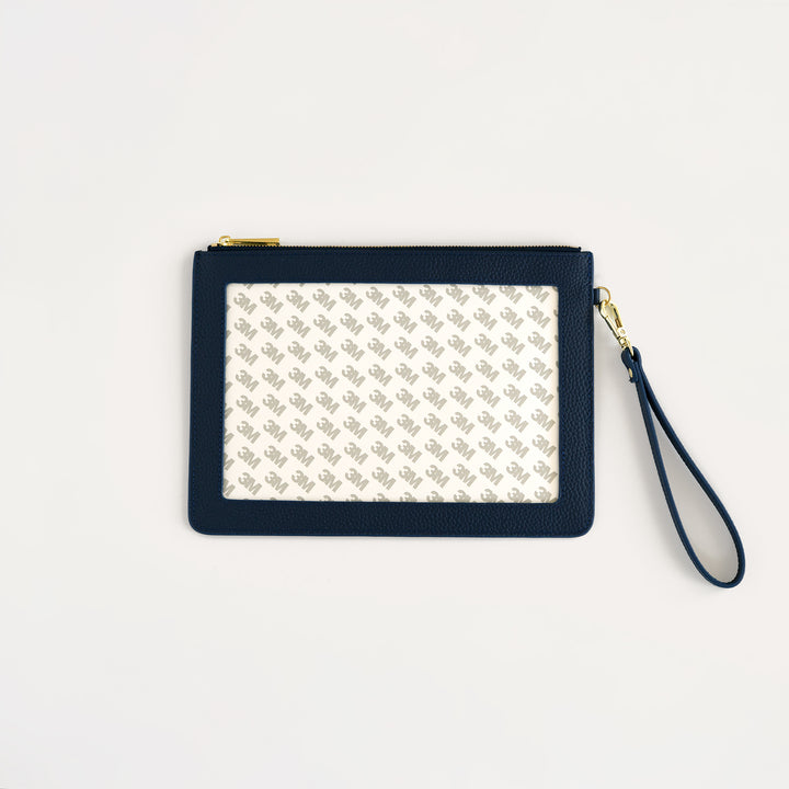 Classic navy leather self finishing needlepoint wristlet with gold hardware