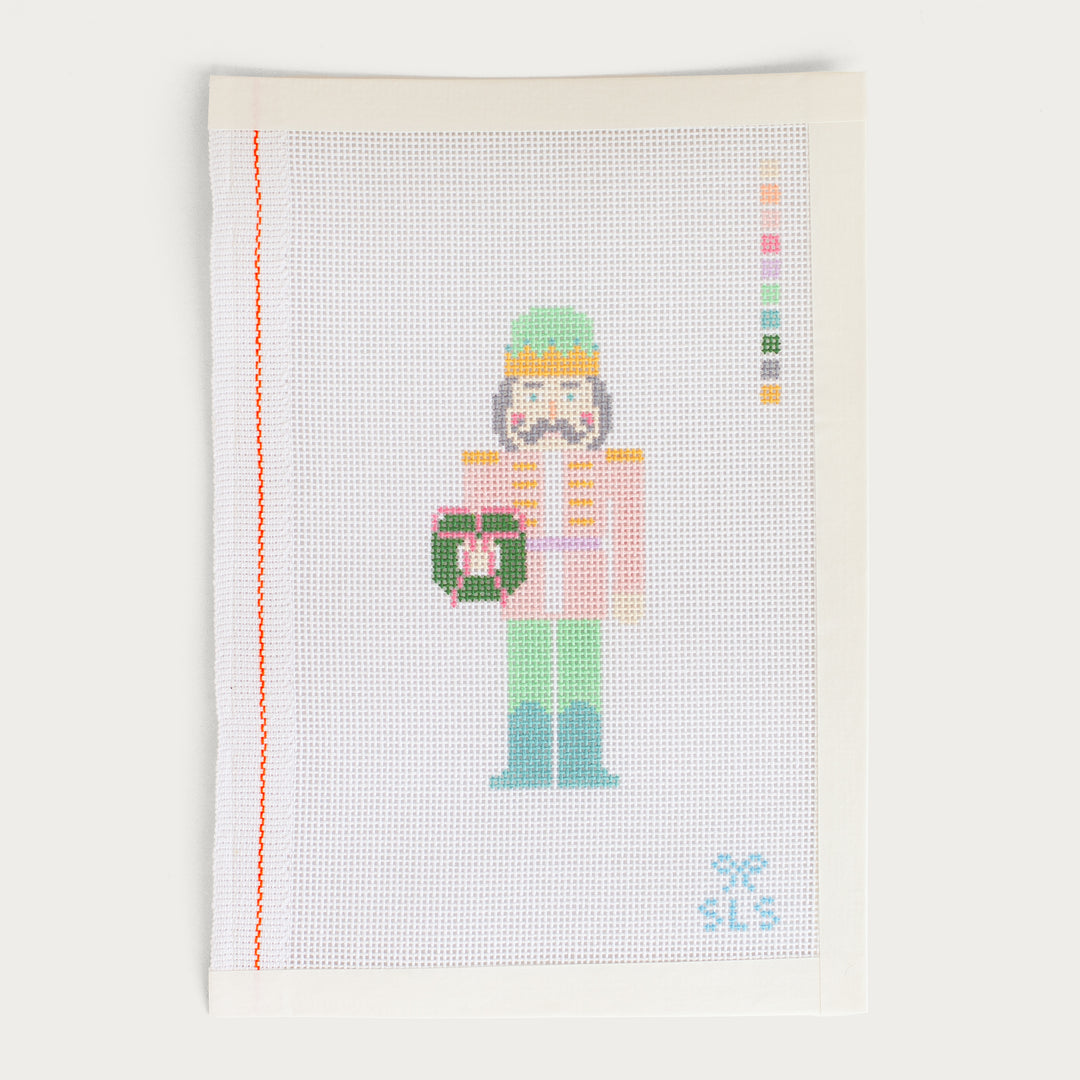 Hand-painted Pastel Nutcracker needlepoint canvas on 18 mesh, featuring a soft-colored holiday design.