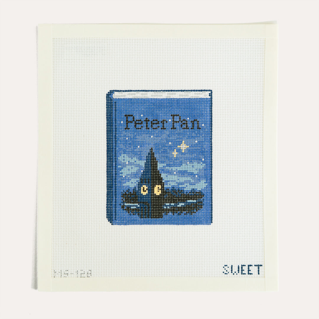 Peter Pan Book needlepoint canvas by Madde Sweet Designs featuring a classic book design on 18 mesh canvas.