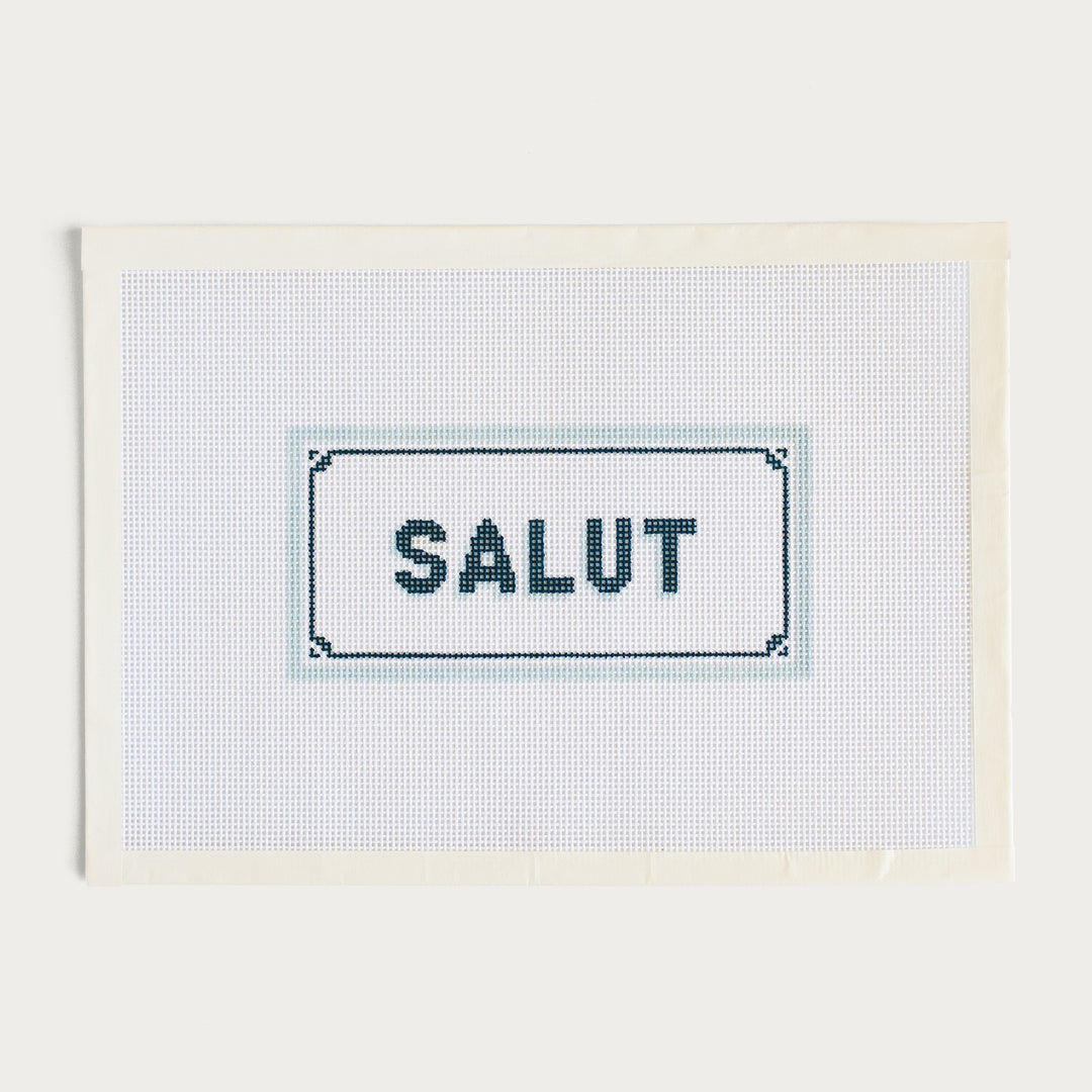 Hand-painted Salut needlepoint canvas featuring a chic French greeting design.