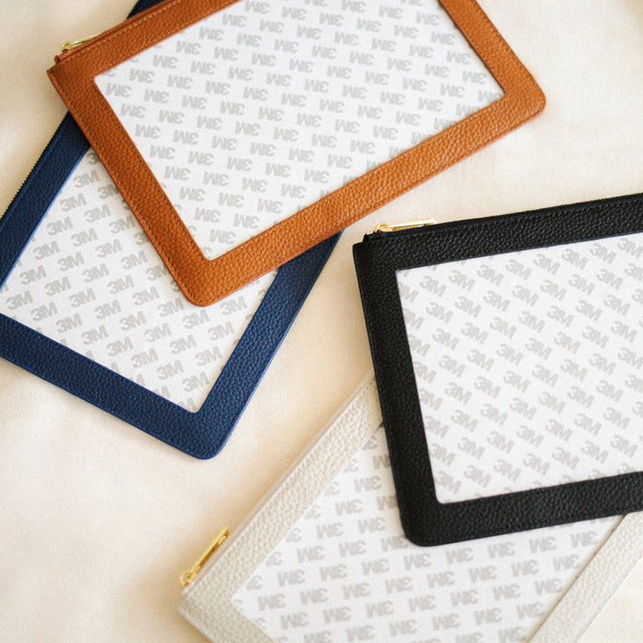 Leather self finishing wristlets for needlepoint canvases by the needlepoint vault in brown, black, beige, and navy