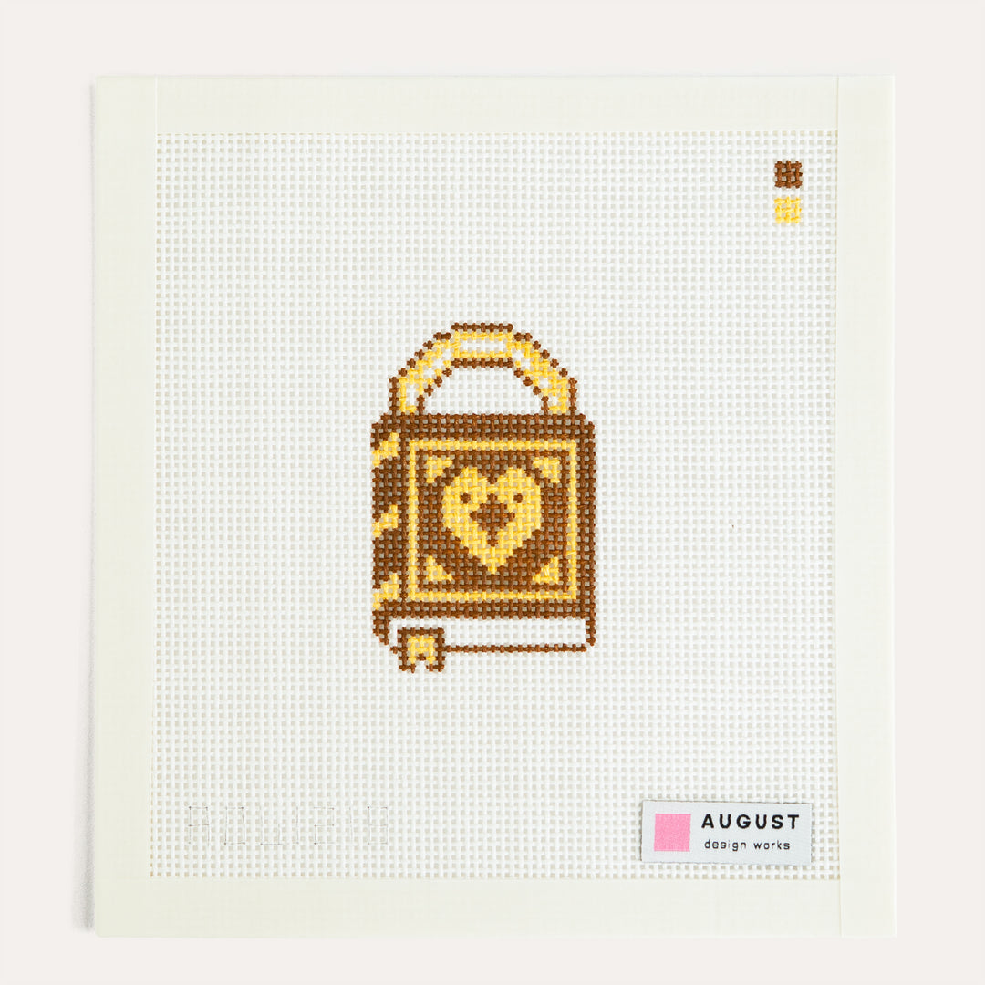 Storybook Love Lock needlepoint canvas by August Design Works with a golden key charm on 13 mesh canvas.