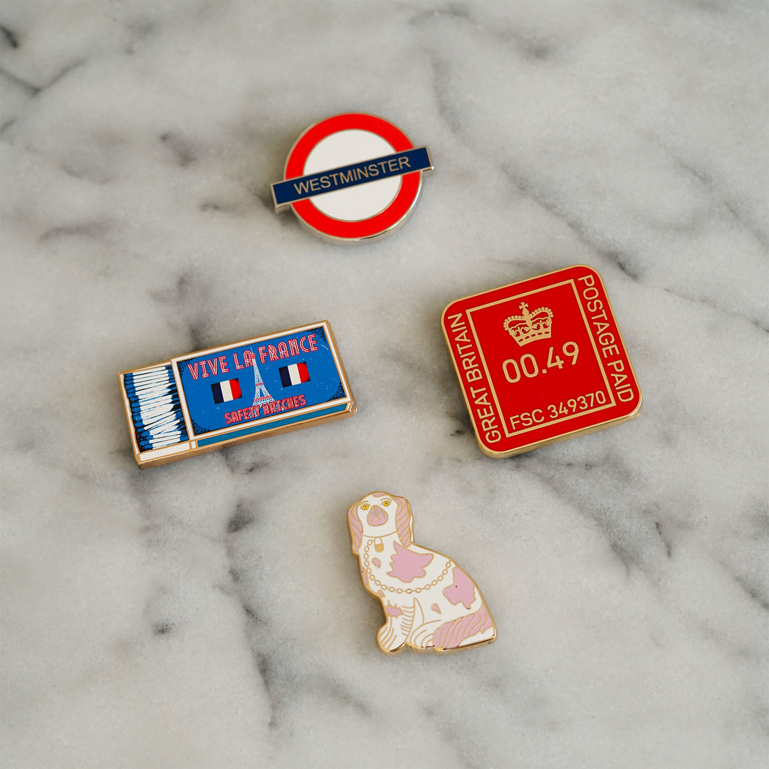 Four enamel needle minders by Go Stitch Studio